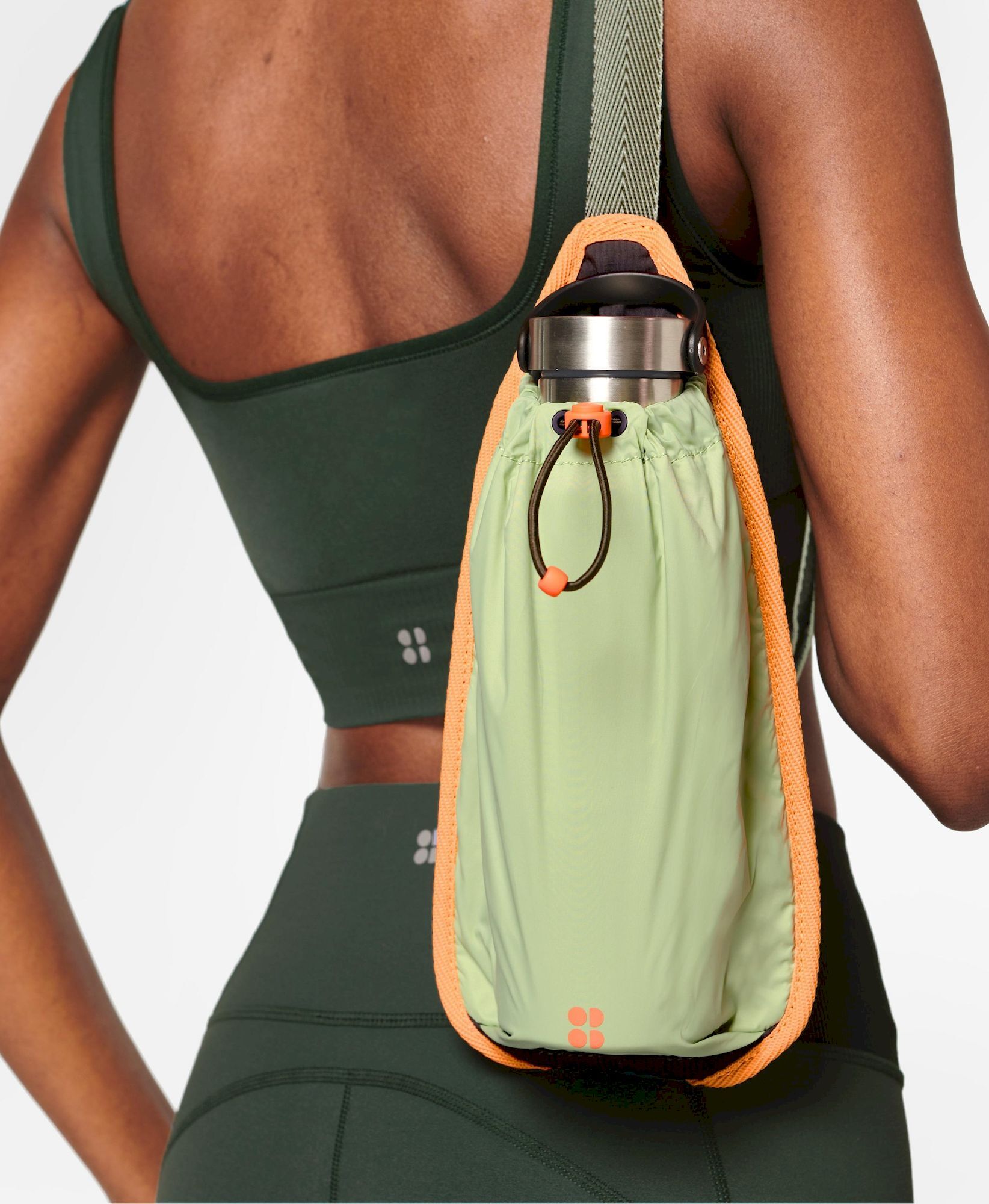 Daypack with water outlet bottle holder